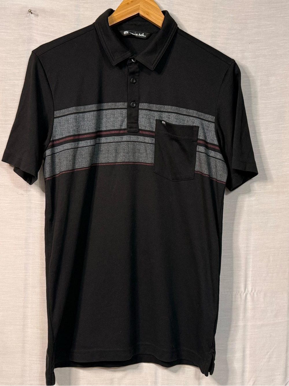 TravisMathew Men’s Medium Black Striped Pocket Golf Polo